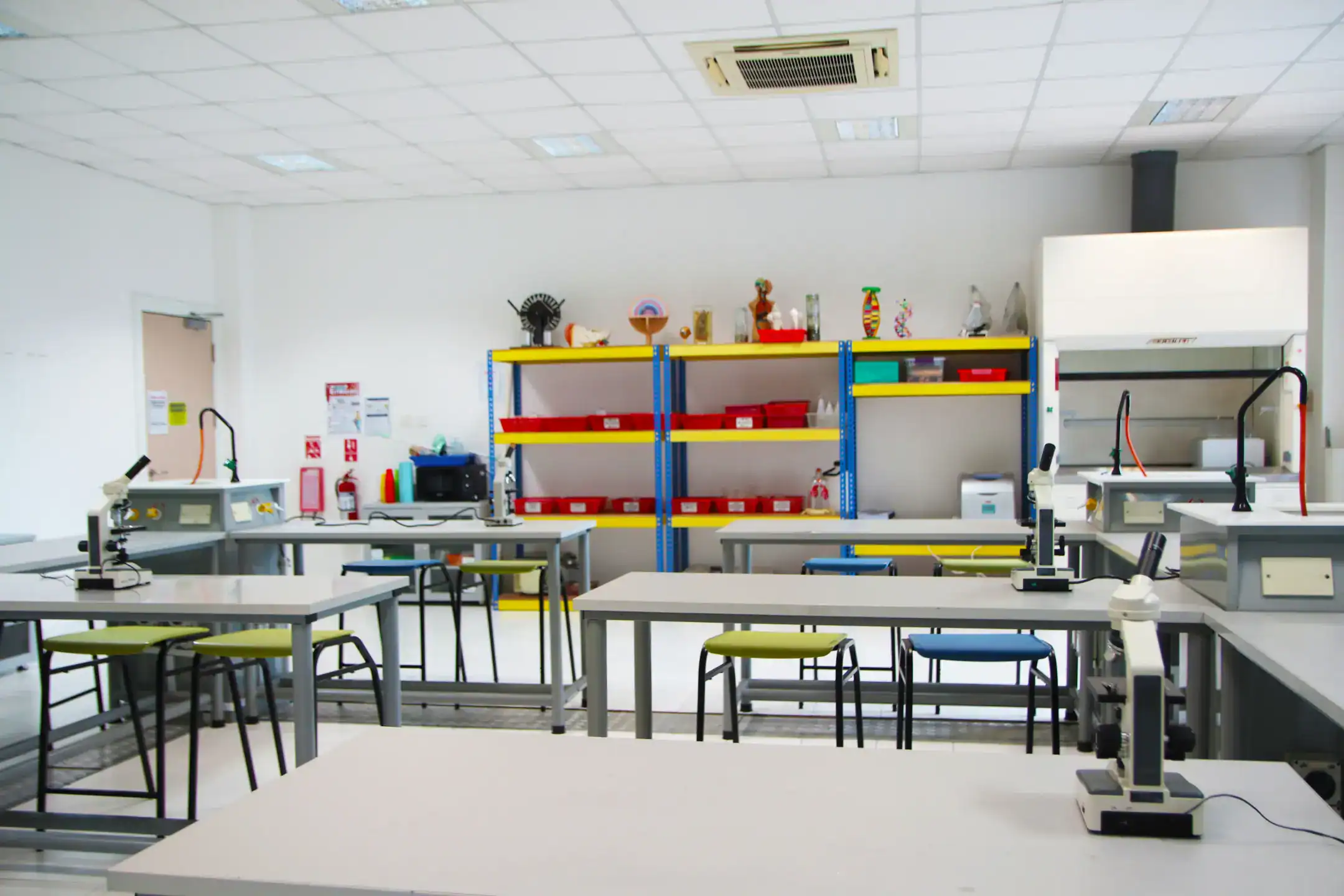 Bright science classroom at World Schools with microscopes and educational materials for STEM learning.