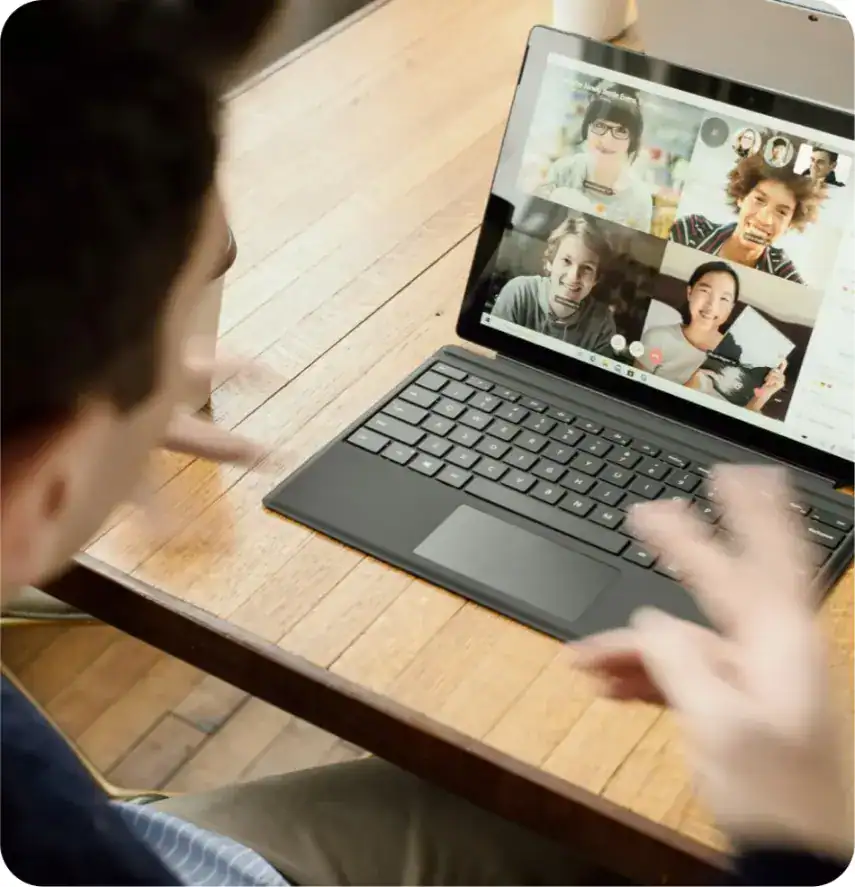 Bright kids participating in an online virtual class using a laptop for remote learning.