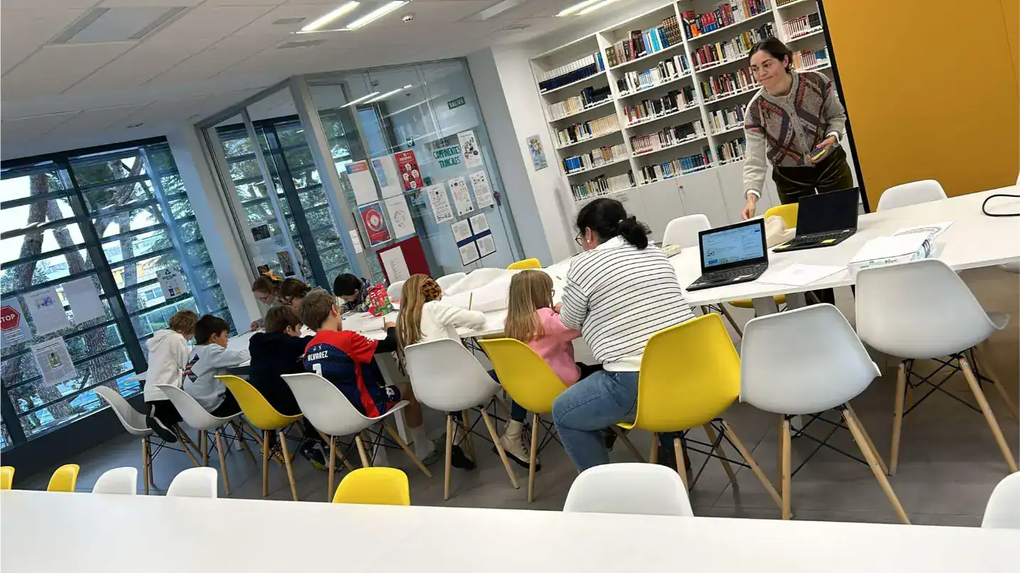Students engaging in collaborative learning at a modern world school library.
