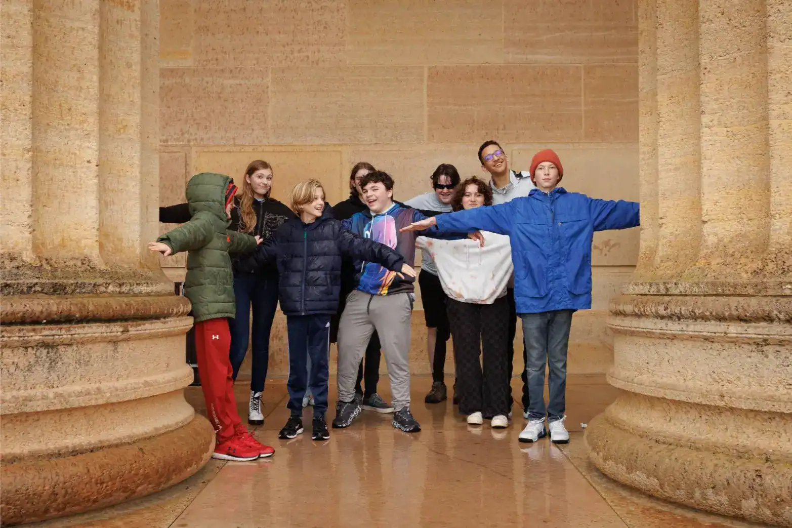 Children enjoying a school trip at an ancient historic site, promoting global education and cultural exploration.