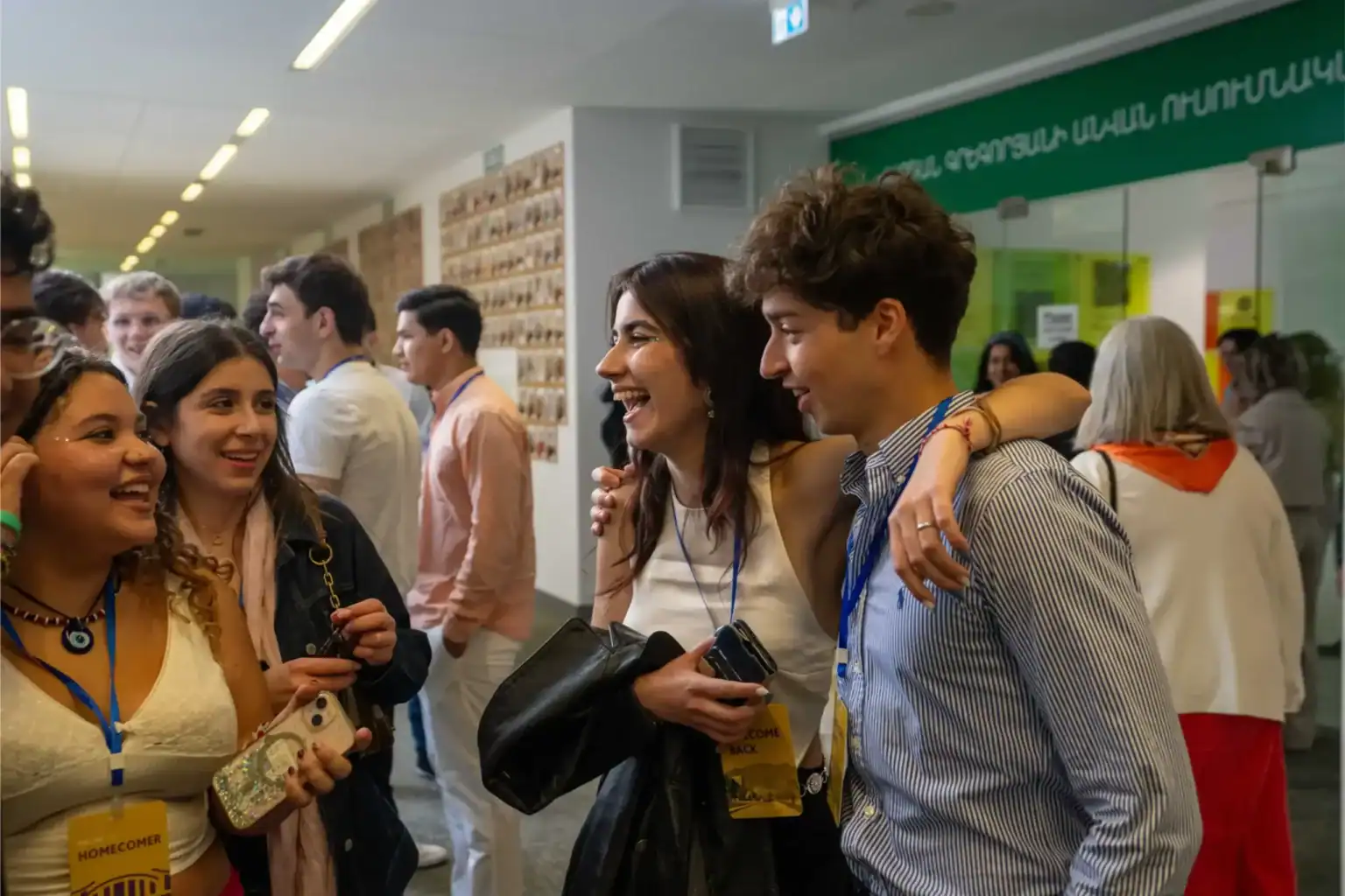 Bright students and educators share joyful moments at a World Schools event, celebrating international education and diverse learning communities.