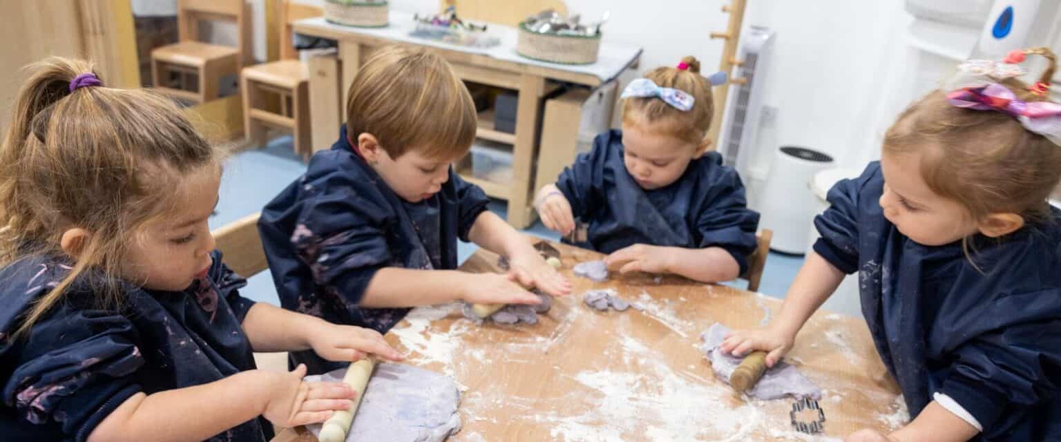 Children engaging in creative arts and crafts activity at a world school.