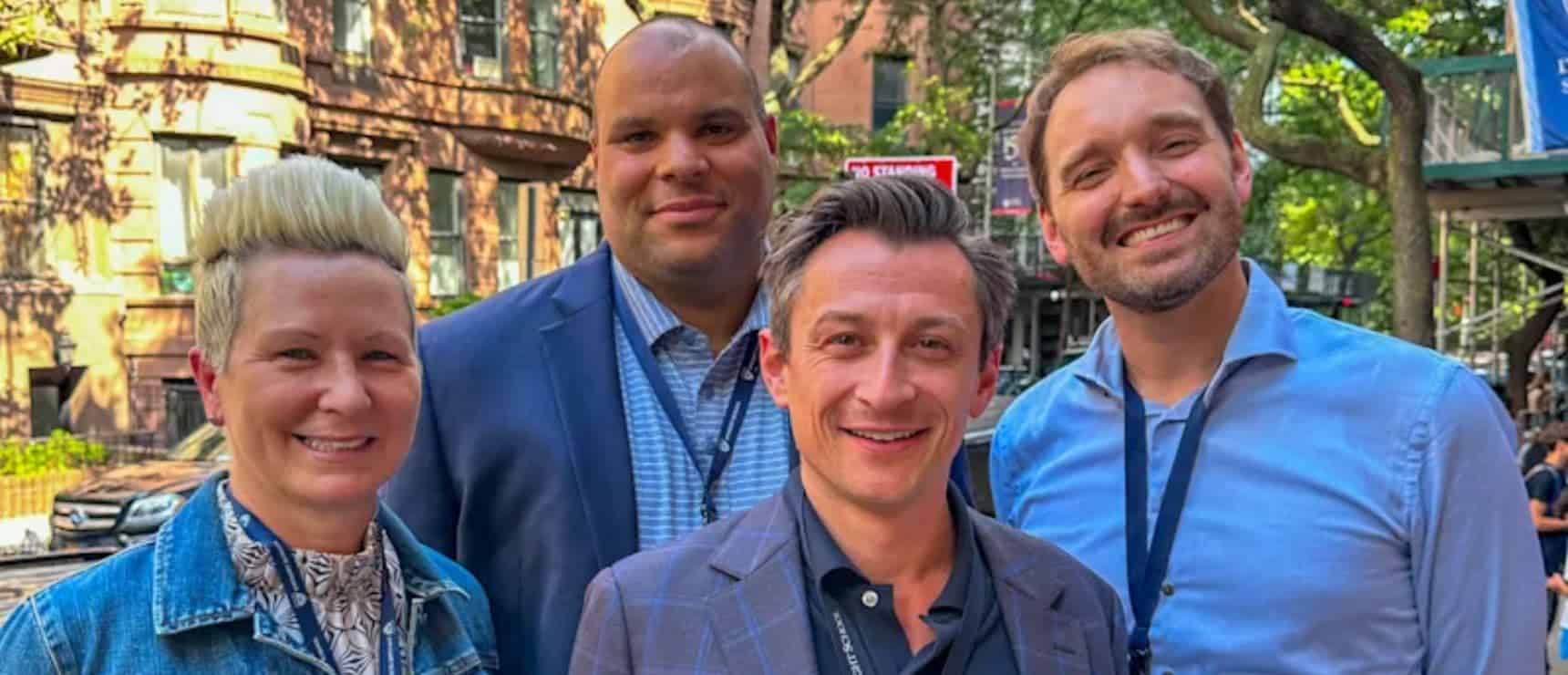 Diverse group of professionals at World Schools event, showcasing global education excellence and collaboration.