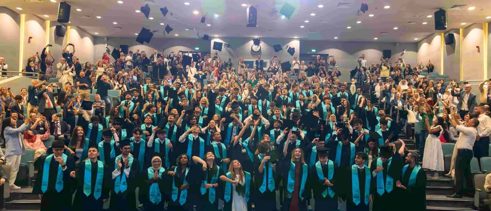 Graduates celebrating at a World Schools graduation ceremony, showcasing academic excellence and global education opportunities.