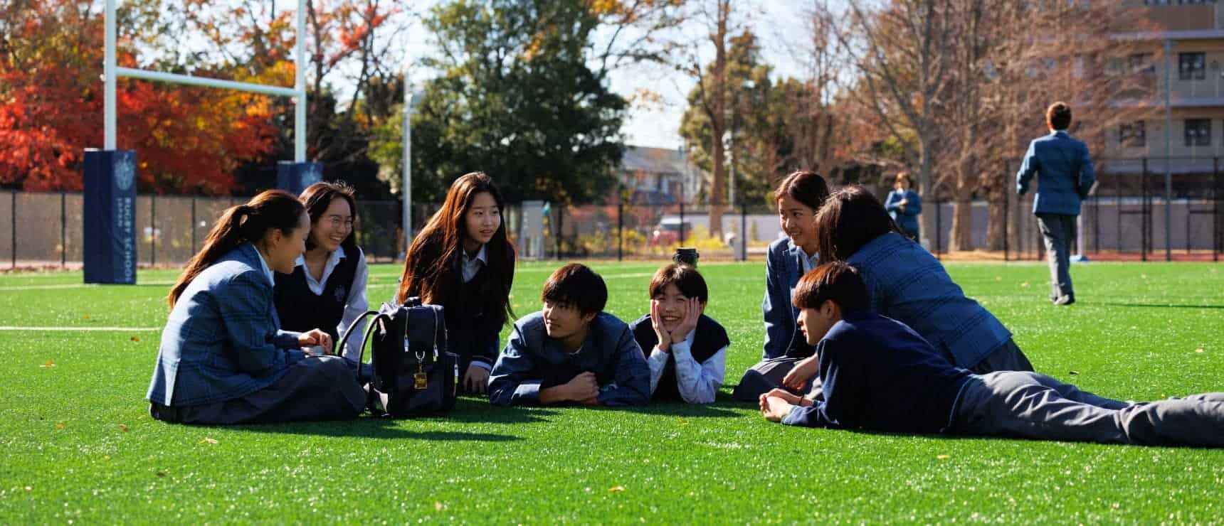 Students engaging in outdoor activity at a world school campus, promoting global education and multicultural learning environments.