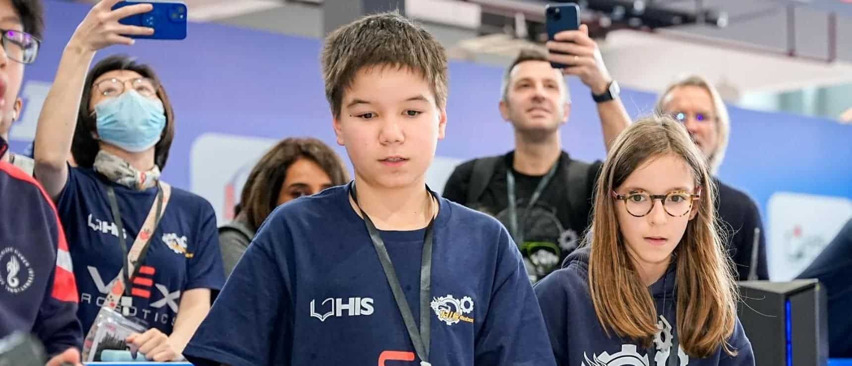 Innovative students at World Schools robotics event, showcasing STEM skills and teamwork.