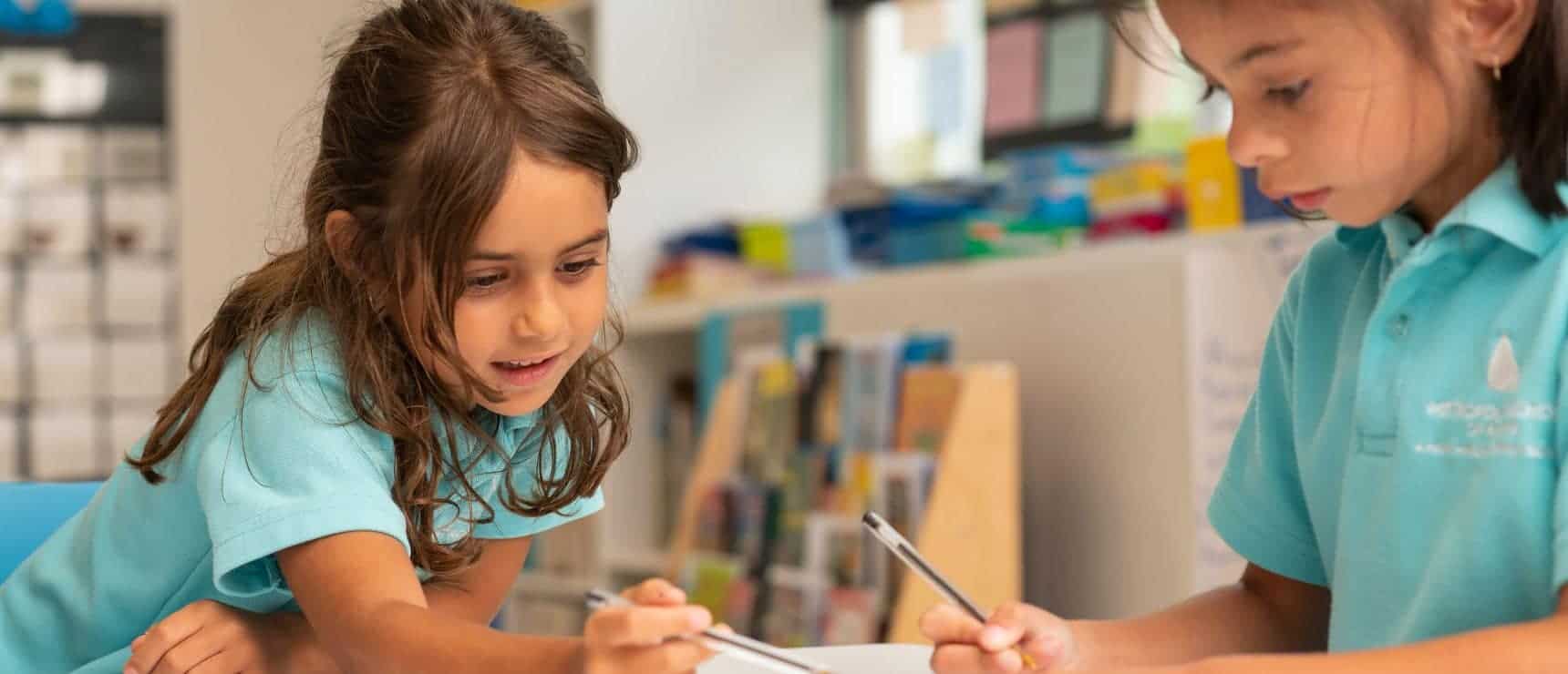 Bright young students collaborating in a classroom at World Schools, fostering academic excellence and innovative learning.