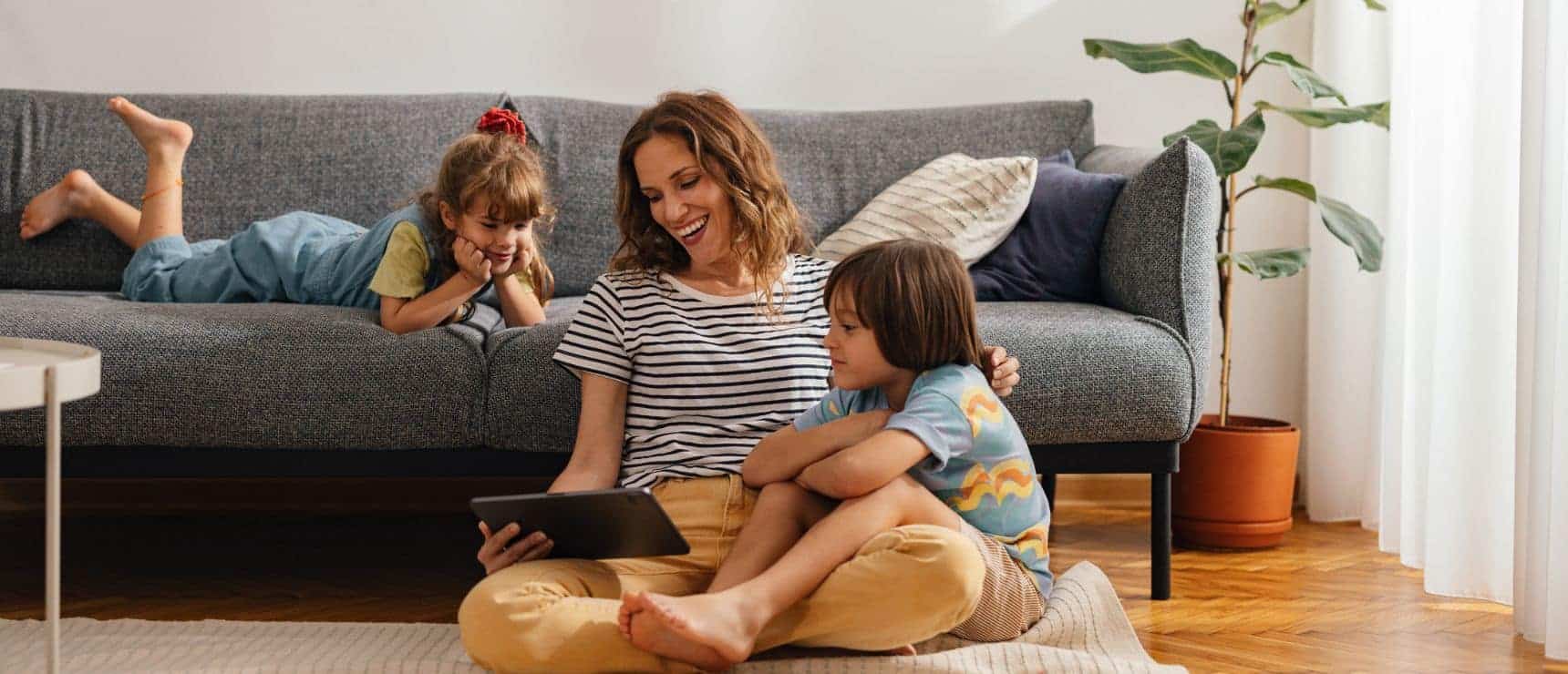 Engaging family time with children using a tablet at home.
