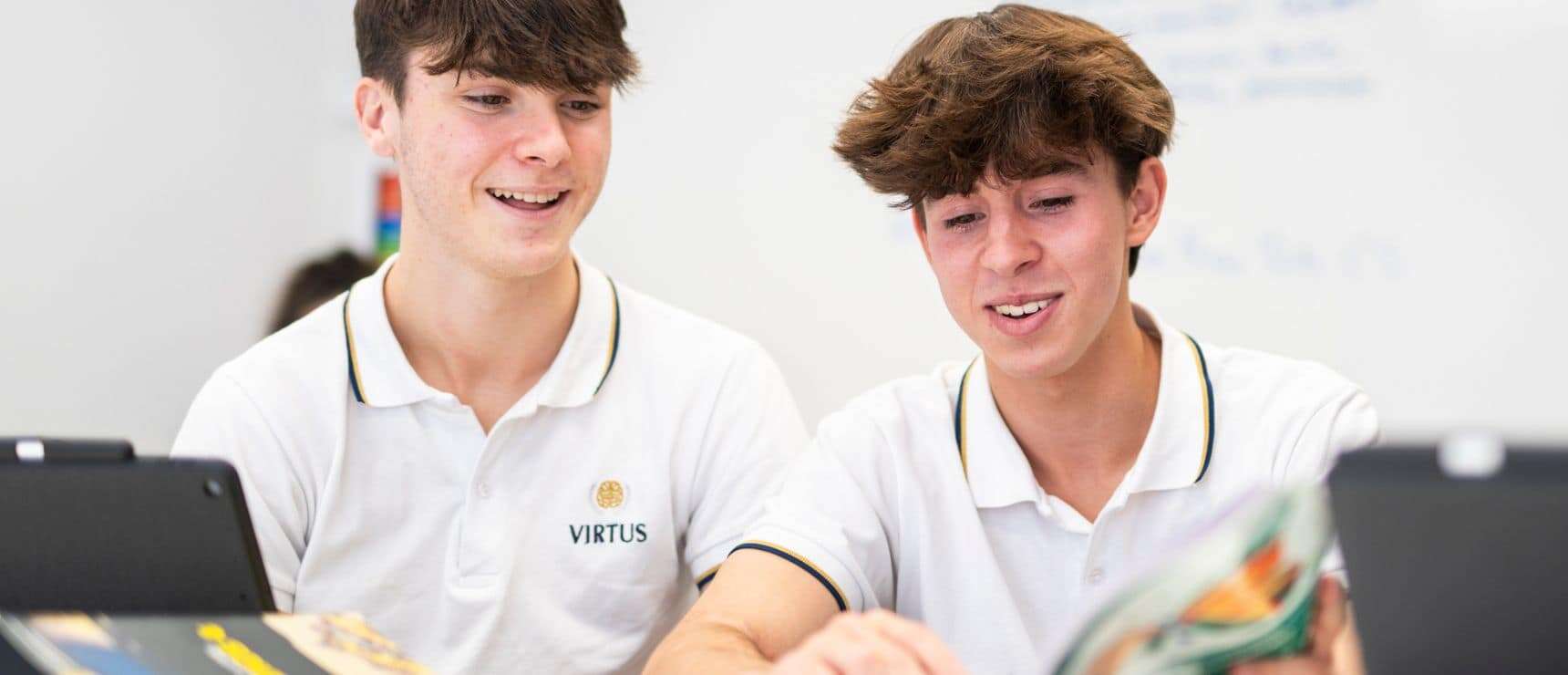 Bright young students collaborating in a modern school classroom focused on academic excellence and global education.