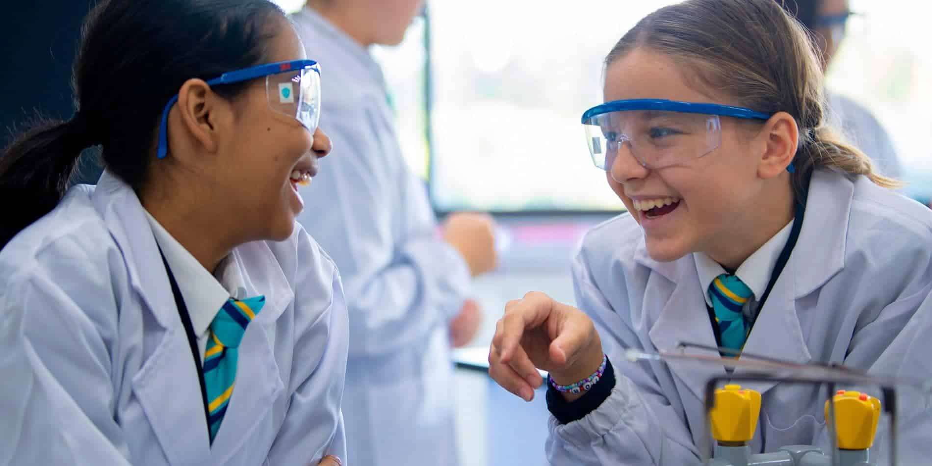 Innovative science students collaborating in a modern classroom at World Schools, fostering global education excellence.