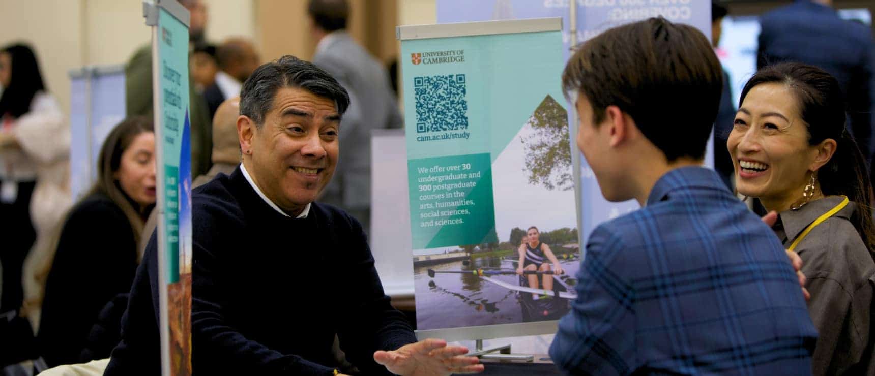 Excellent international students engaging at World Schools education fair, showcasing university opportunities for global learners.