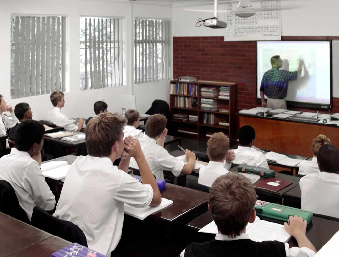 Students learning in a world schools classroom with interactive technology and modern teaching methods.