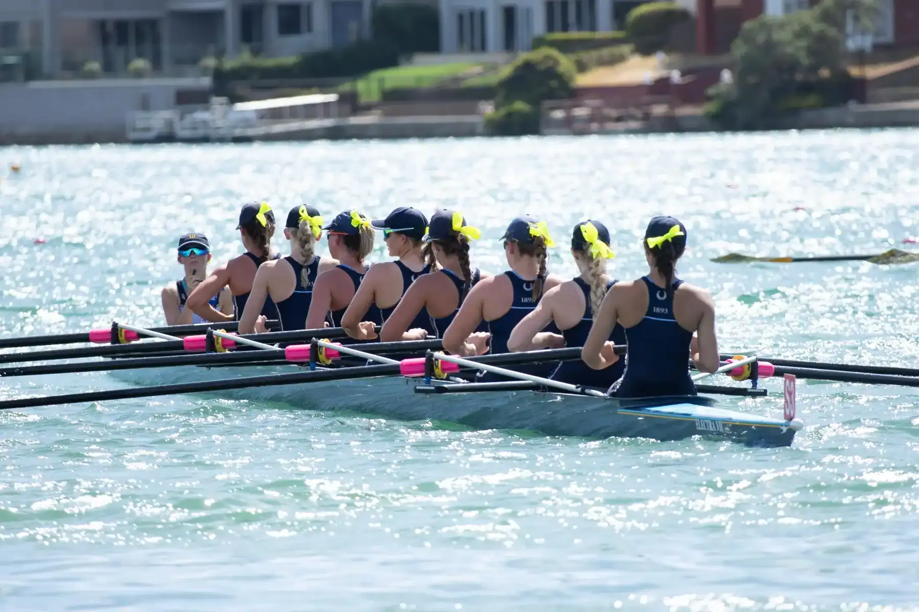 Rowing team of students practicing on the water at Walford Anglican School for Girls.