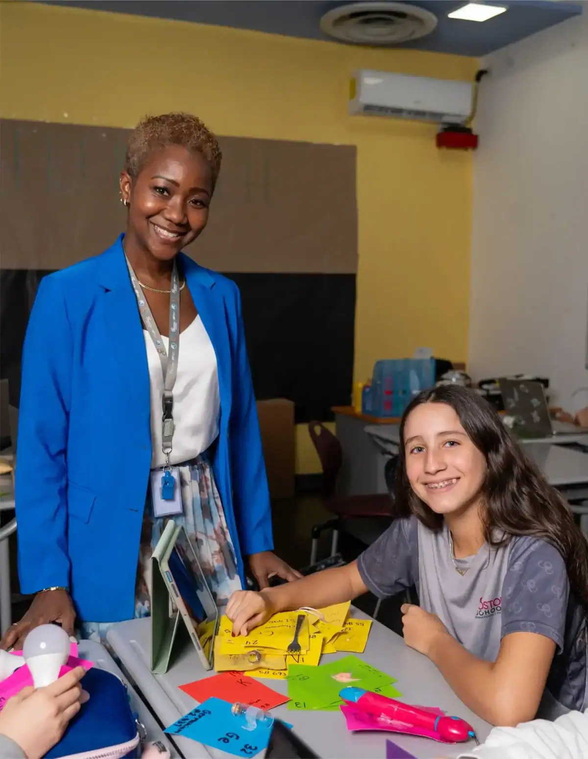 Diverse student engaging in classroom activity at Boston School International.