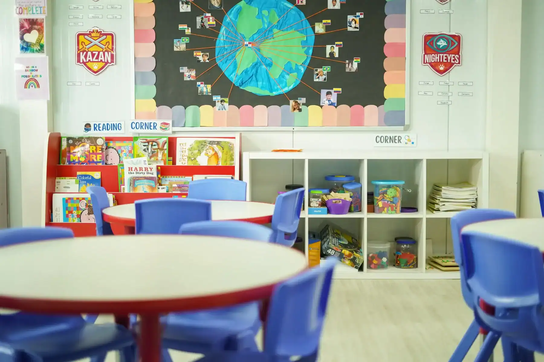 Bright classroom with colorful books and educational displays for young learners.