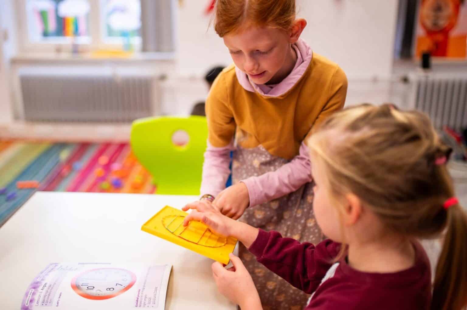 Engaging young students with educational toys in a modern classroom for early childhood development.