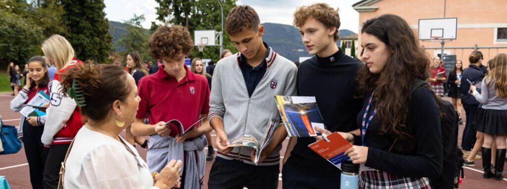 International school students engaging in outdoor learning activities at World Schools event.