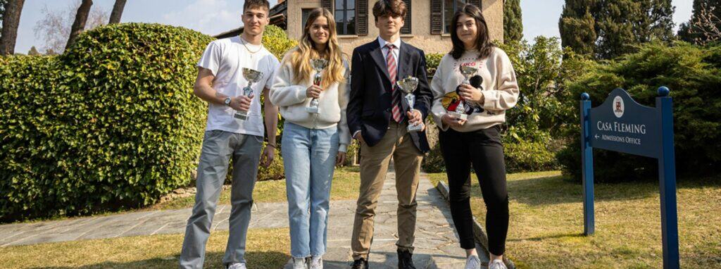 Young students celebrating academic achievement at World Schools, known for prestigious international education.