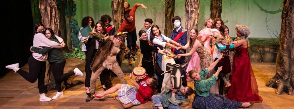 Exciting school theater performance with students dressed as characters from "The Lion King".