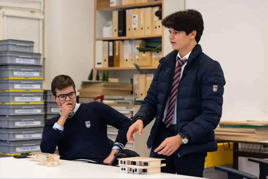 Creative students engaged in architecture classroom at World Schools, fostering innovation and teamwork.