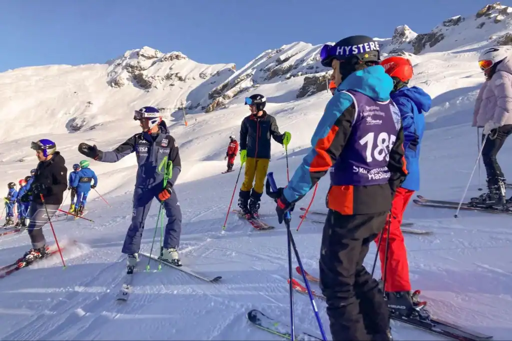 Kids learning to ski on snowy mountain slopes at a world-class ski resort.