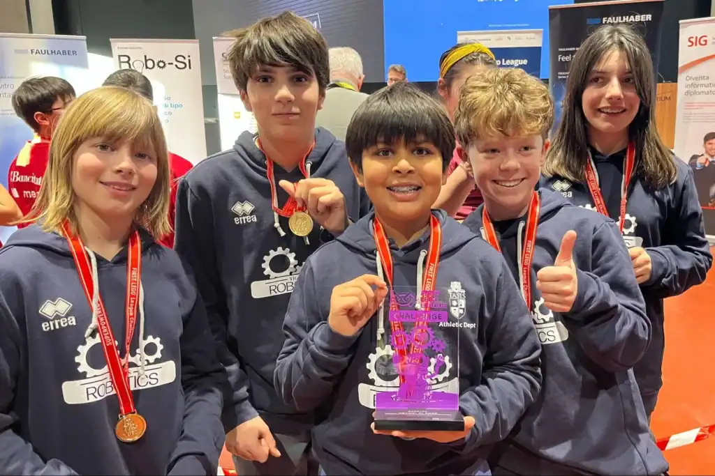 Robotics competition winners, talented students from World Schools, celebrating achievement and teamwork.