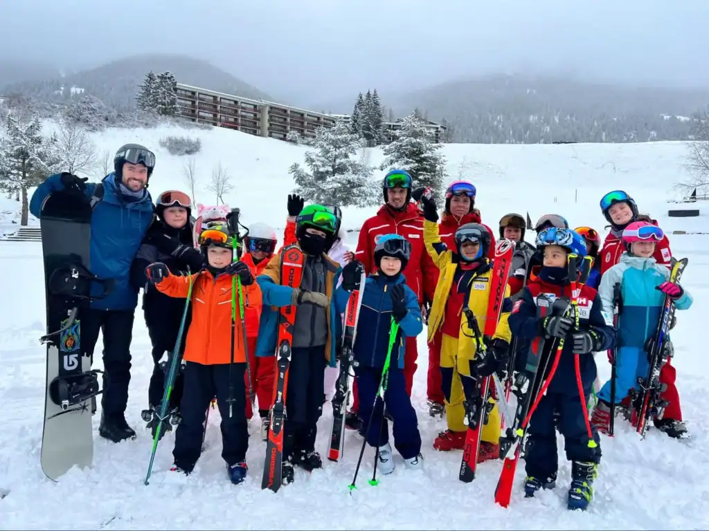 Family ski trip with children at snow-covered mountain resort, winter sports, skiing, snowboarding, outdoor adventure, kids’ winter activities.