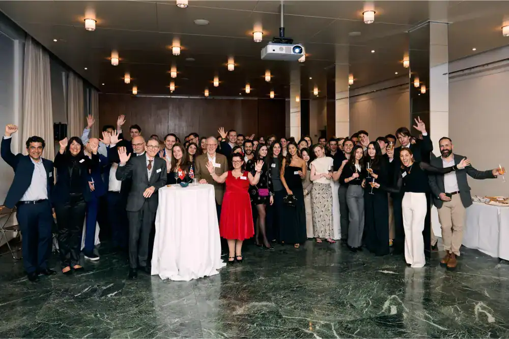 This Month at TASIS: March 2025 9 Diverse group of professionals celebrating at a formal event, representing international excellence in education.