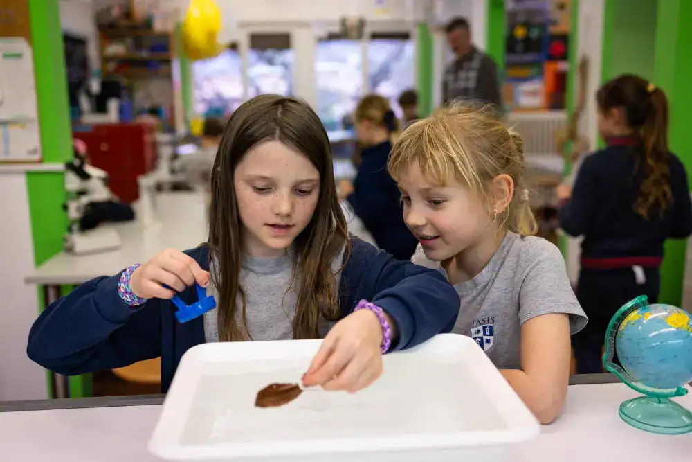 This Month at TASIS: March 2025 11 Colorful classroom with young students engaging in science activity, promoting innovative learning and global education.