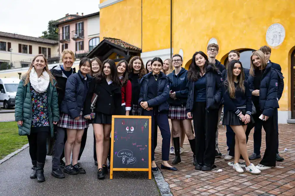 This Month at TASIS: March 2025 13 Diverse group of students and teachers at World Schools event promoting international education excellence.