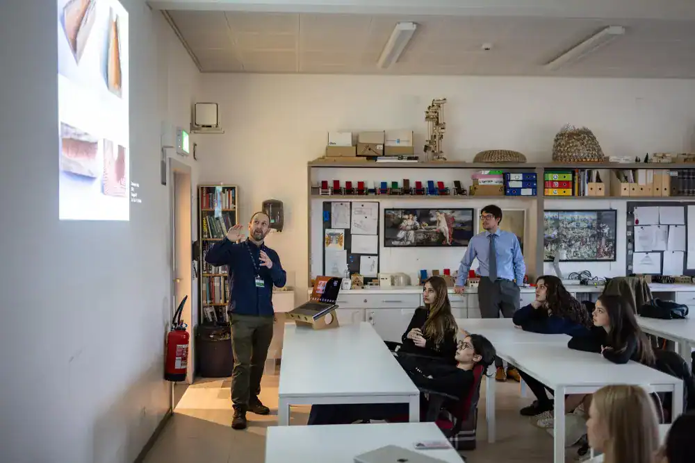 This Month at TASIS: March 2025 15 Modern classroom at a world school showcasing interactive learning environment and diverse students.