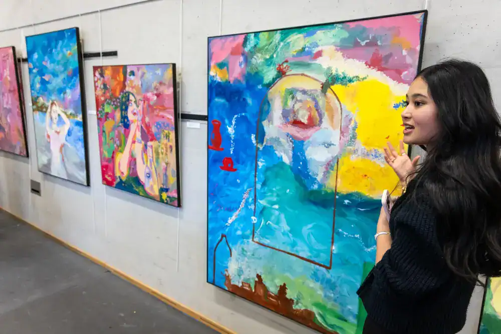 This Month at TASIS: March 2025 21 Vibrant abstract artwork displayed at a multicultural international school art exhibition.