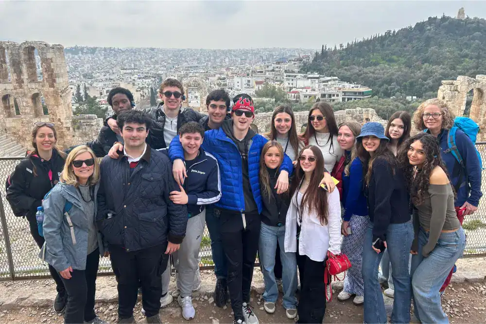 This Month at TASIS: March 2025 4 Students enjoying a guided historical tour at the ancient Acropolis in Athens, Greece.