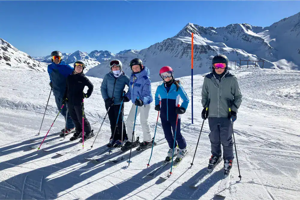This Month at TASIS: March 2025 8 Children skiing on snow-covered mountains during daytime, enjoying winter sports at a world-class ski resort.