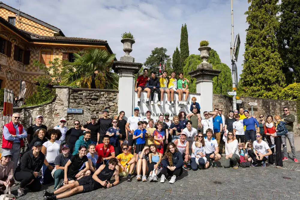 This Year at TASIS: 2024 15 Vibrant group of students and teachers outside historic school building during educational trip.
