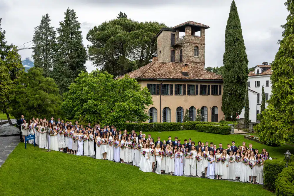 This Year at TASIS: 2024 20 Lush greenery and a large group of students celebrating graduation at World Schools in Italy.