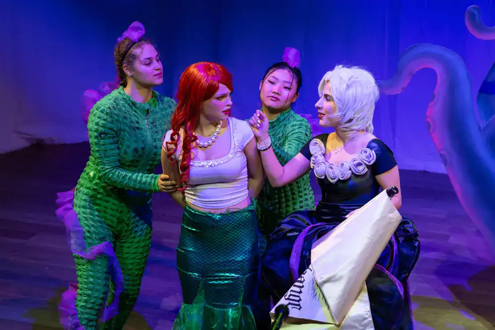 This Year at TASIS: 2024 8 Vibrant scene of young students in a theatrical performance, showcasing creativity and teamwork at World Schools.