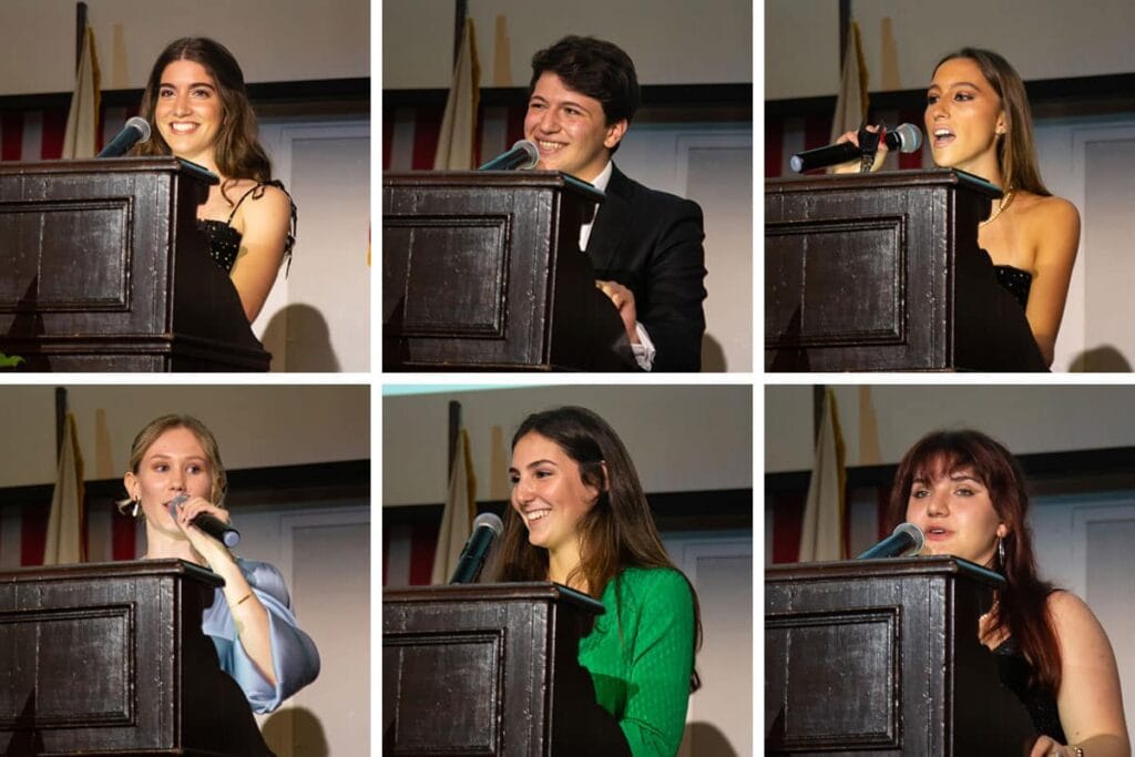 Bright students speaking at a school event, showcasing leadership and confidence.