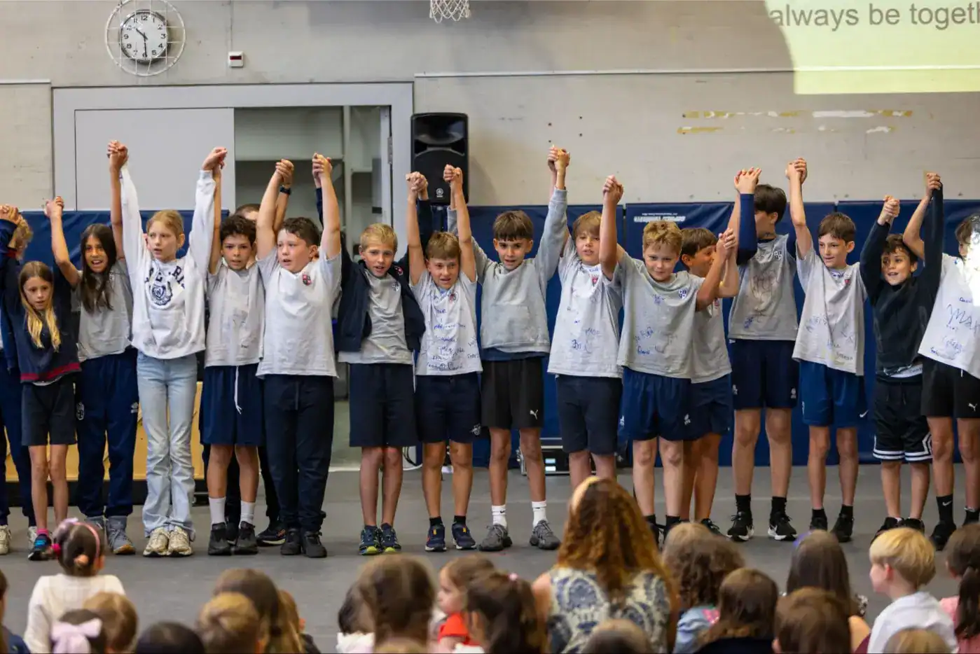 This Month at TASIS: June 2025 6 Children celebrating achievements in a school event at World Schools.