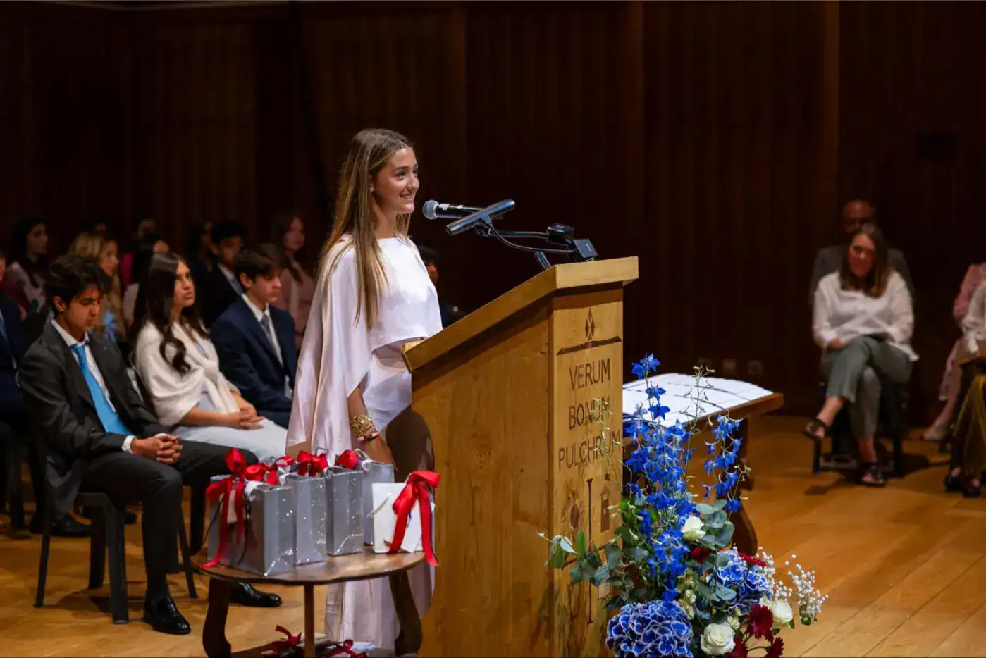 This Month at TASIS: June 2025 7 Advanced international school student giving speech at graduation ceremony.