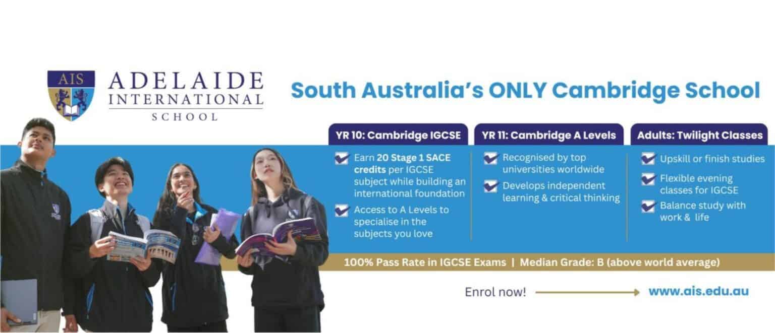 Young students in school uniforms holding books at Adelaide International School, focusing on global education.