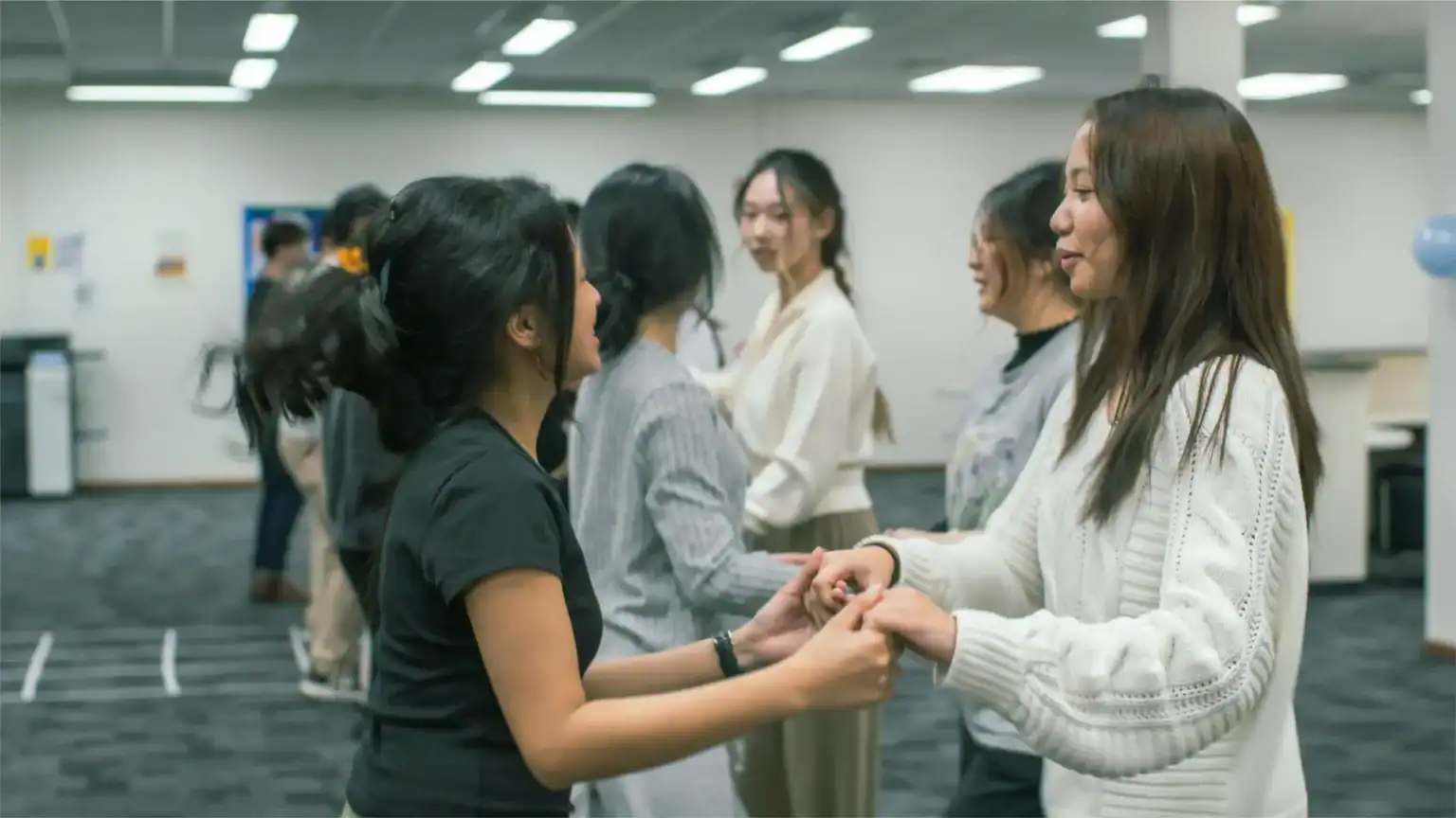 Diverse students engaging in friendship activity at an international school in a modern education environment.