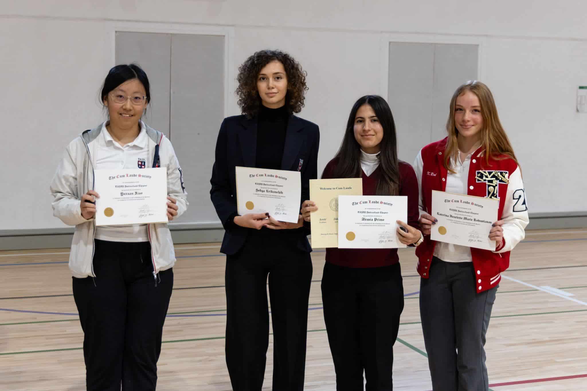 This Month at TASIS: May 2025 4 Outstanding students receiving awards at a top international school event; fostering academic excellence and leadership.