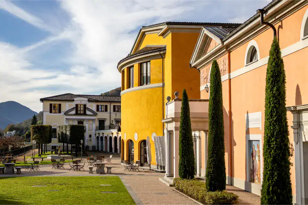 This Month at TASIS: November 2024 4 Beautiful European-style World School campus with colorful buildings and lush outdoor spaces.