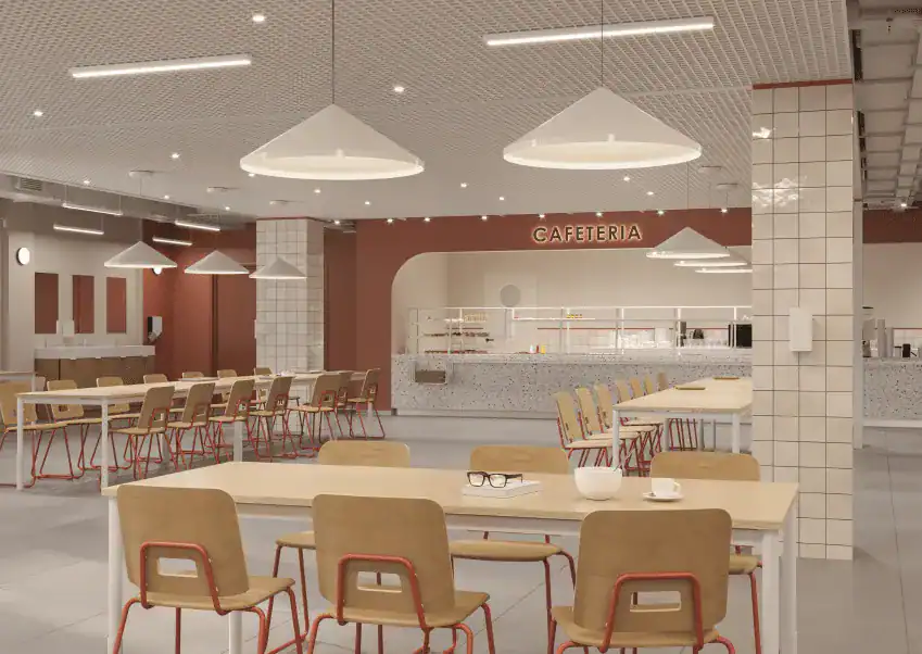 Modern school cafeteria with bright lighting and comfortable seating, designed for student dining and socialization.