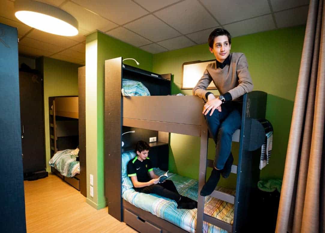 Reserved bunk beds in a modern student dorm room, ideal for international students at world schools.
