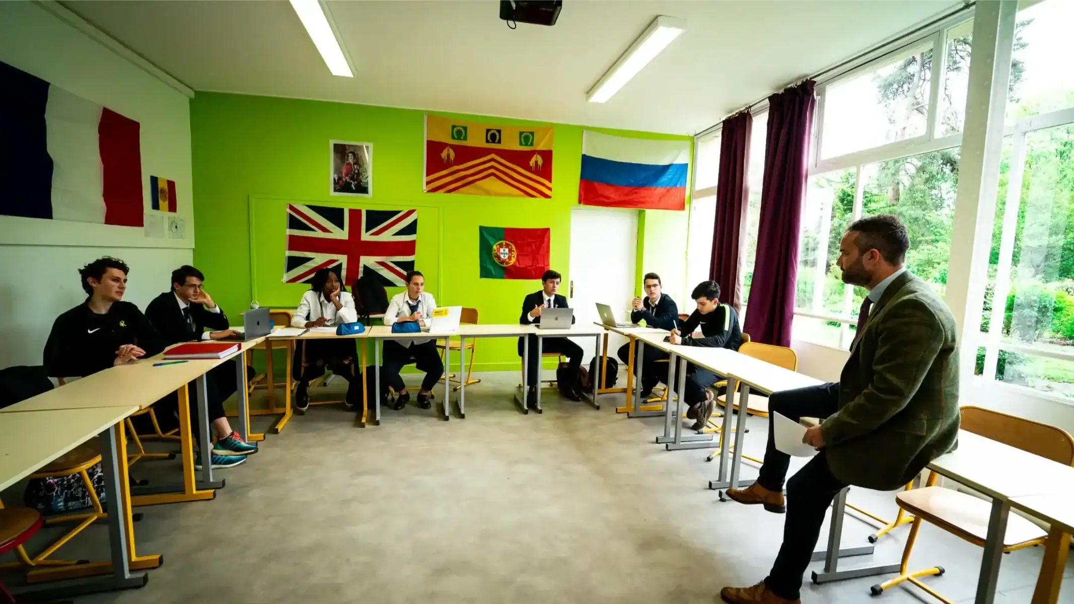 Diverse students in an international classroom with flags, engaged in a learning discussion, promoting global education and diversity.
