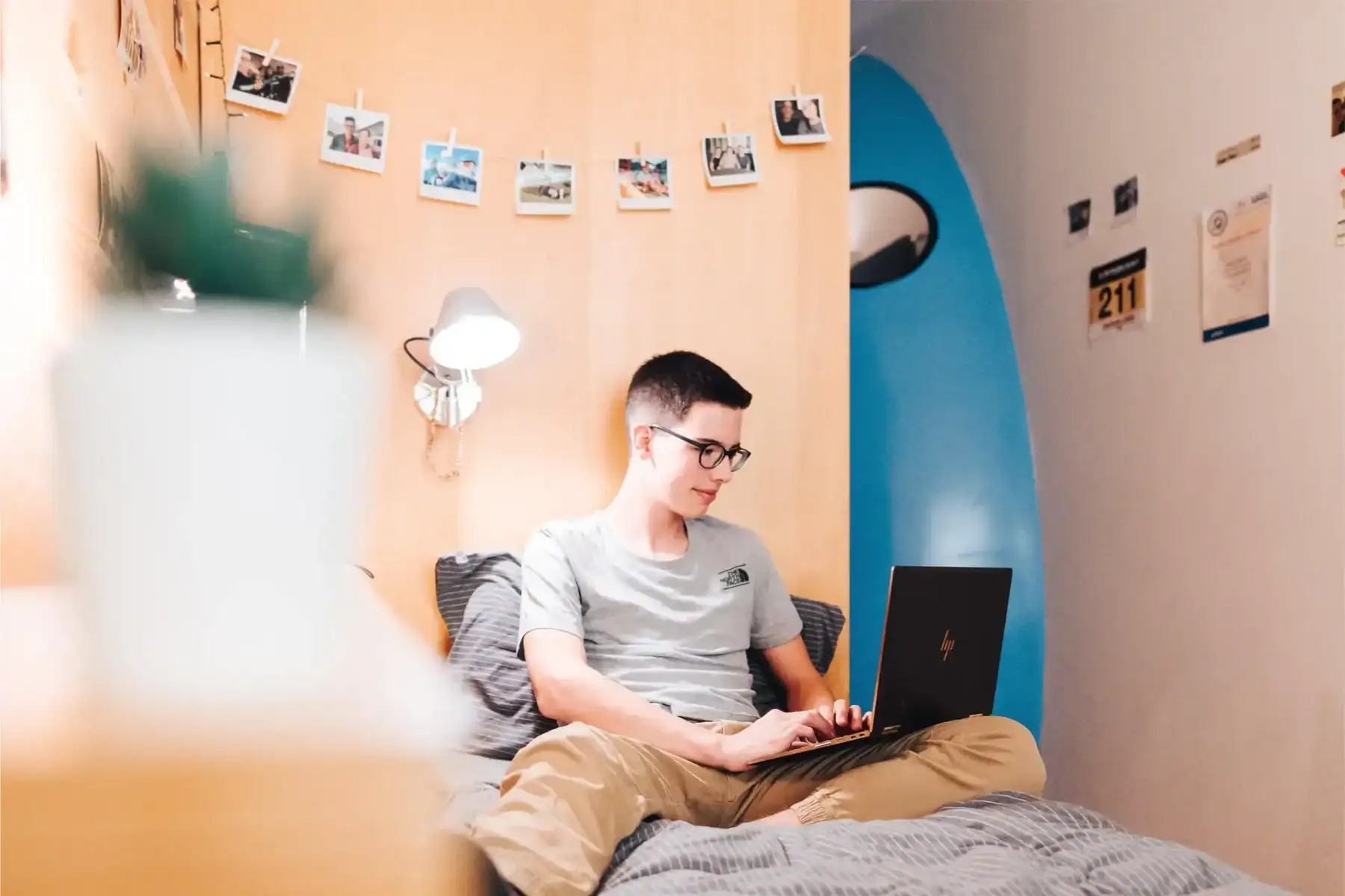 Young student studying at home with a laptop, representing world schools and online learning.