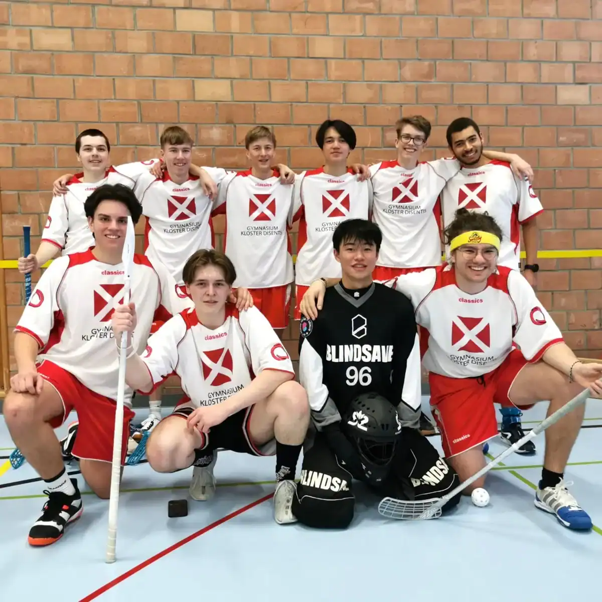 Hockey team from World Schools, showcasing athletic talent and teamwork in indoor sports.