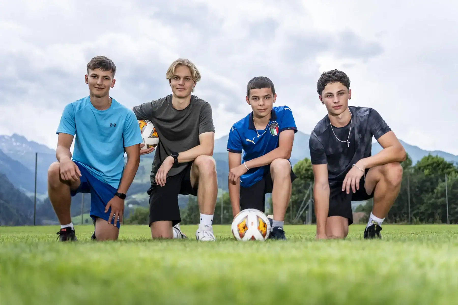 Youth soccer team in uniform on outdoor field, emphasizing sports education at World Schools.